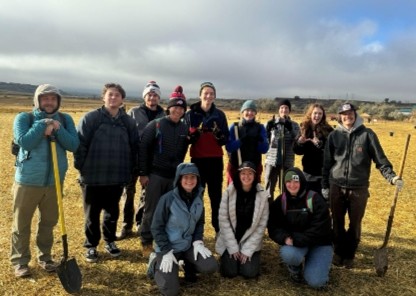 Group of students holding shovels 